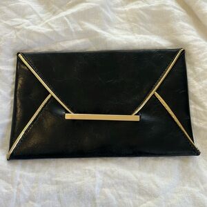Gold trim envelope clutch